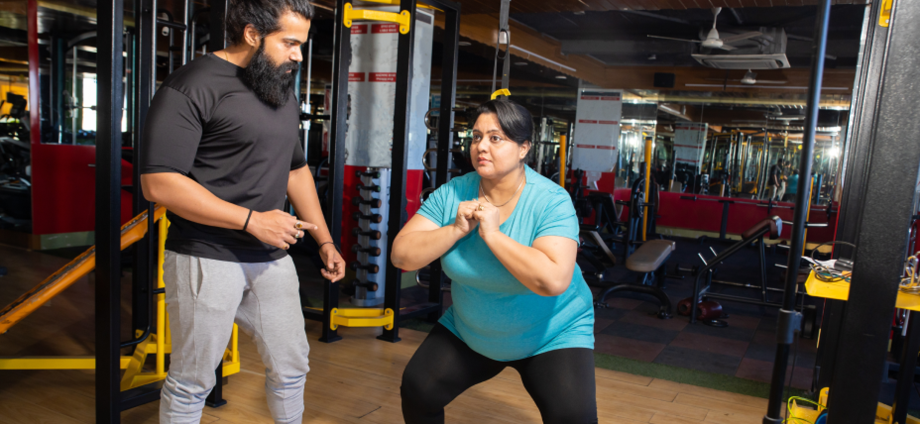 two people exercising in a gym